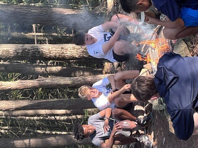 Briggs and classmates by the fire