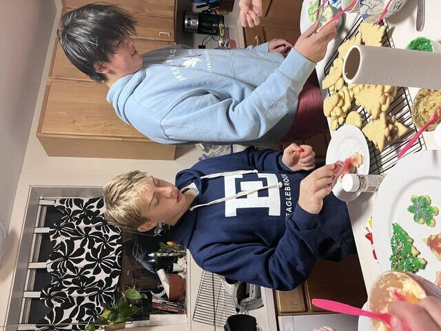 Briggs decorating cookies with a friend