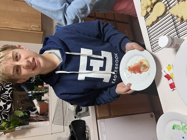 Briggs showing off his decorated cookie