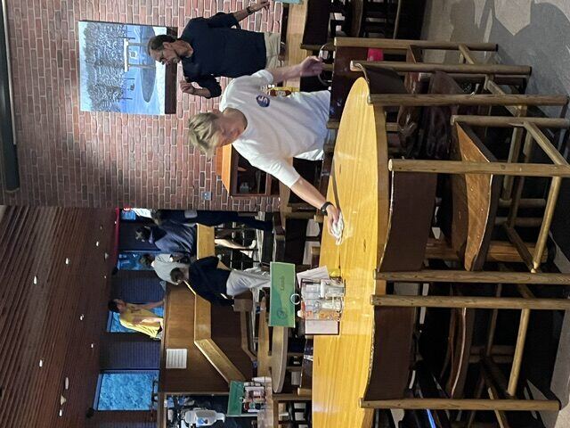 Briggs helping clean up in the dining hall