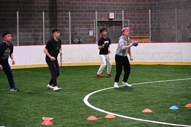 Briggs playing dodgeball with classmates