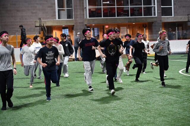 Briggs and classmates running during a dorm event