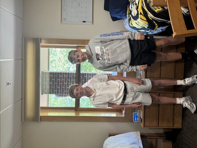 Briggs and his roommate in their dorm room
