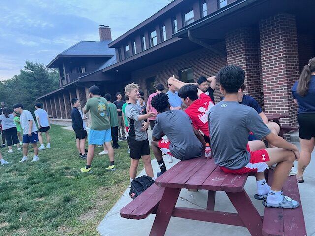 Briggs and classmates hanging out outside the dorm