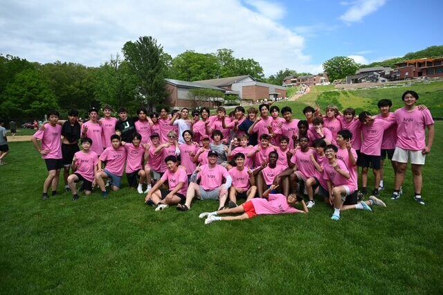 Briggs with his dorm group in matching pink shirts