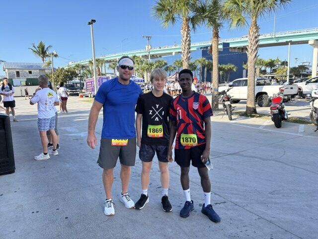 Briggs and his friend after running a 5K on Fort Myers Beach