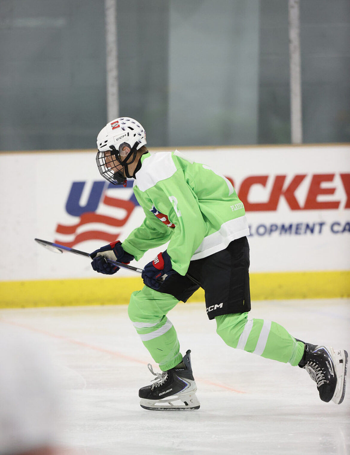 Briggs skating hard in a green jersey