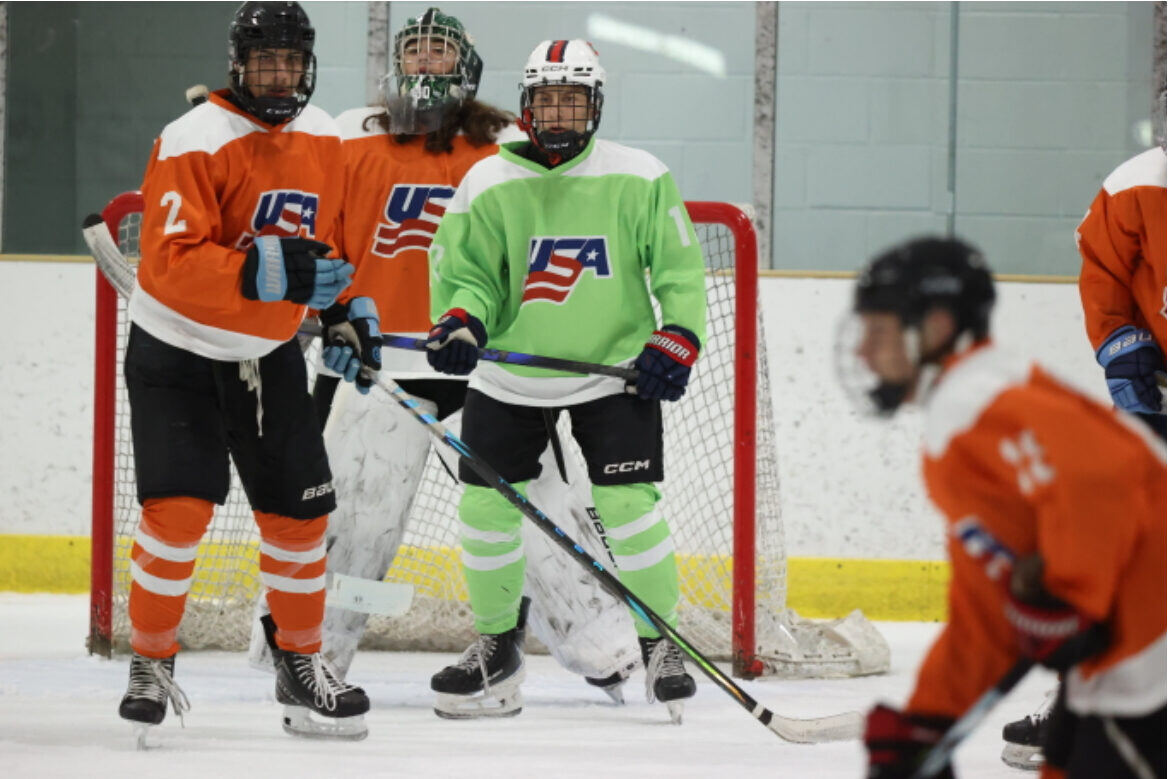 Briggs in front of the net in a green jersey