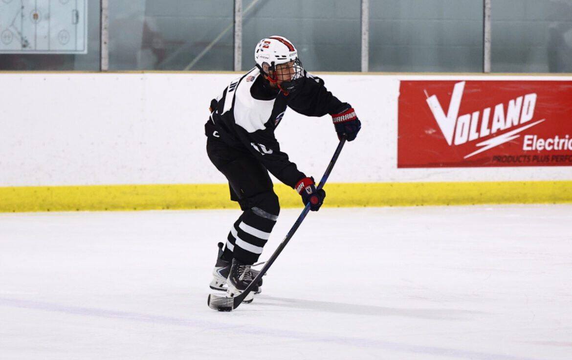 Briggs wearing the captain's C in a black jersey