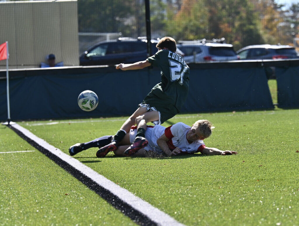 Briggs making a sliding tackle
